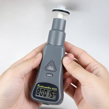 Portable 8008 AZ digital tachometer with contact tips and laser sensors.